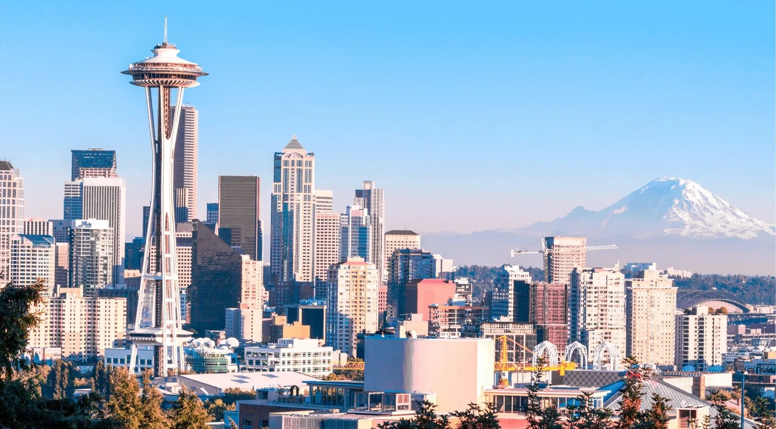 The Seattle skyline with the Space Needle and Mount Rainier on a clear day